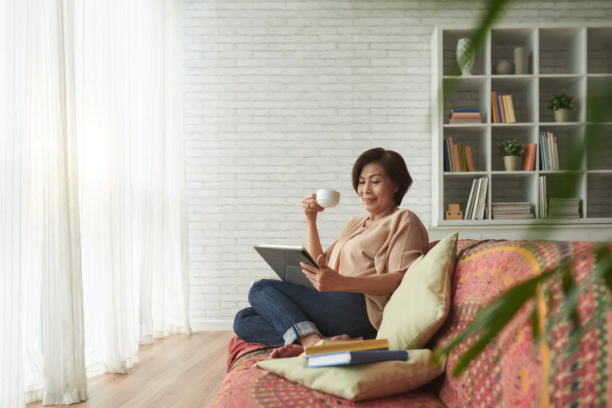 Read books to write better; Woman reading a book on the couch