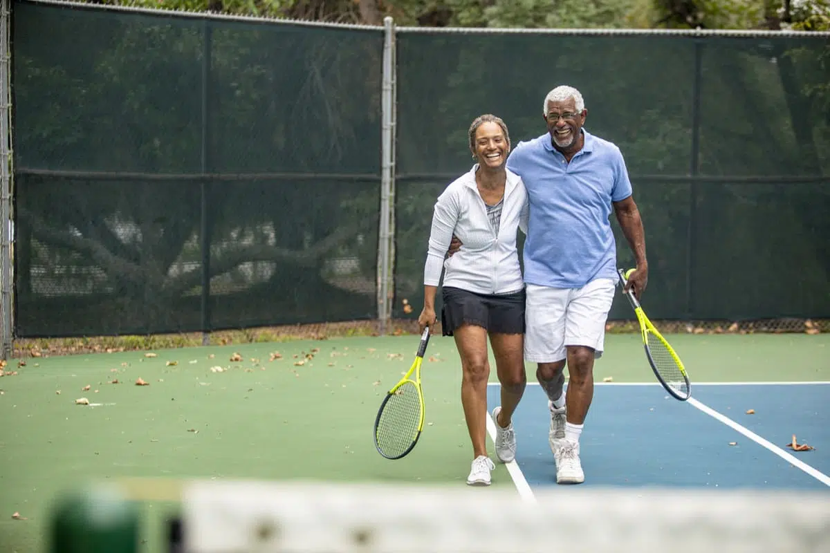 Couple playing tennis