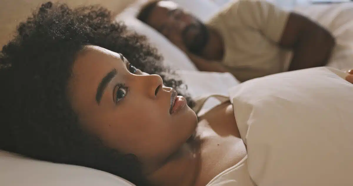Worried woman in bed