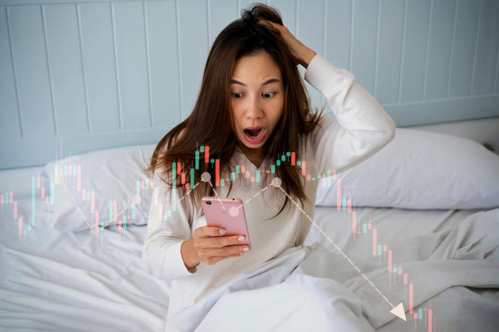 Stressed woman looking at financial market