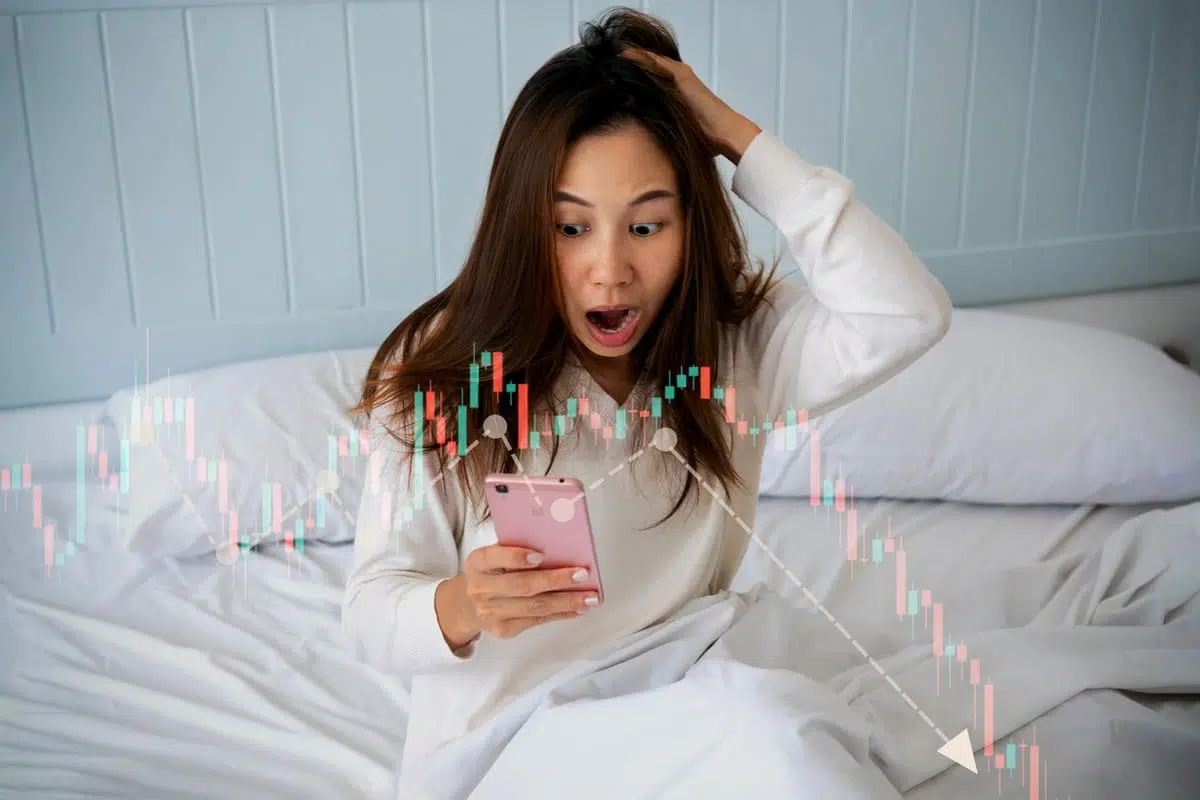 Stressed woman looking at financial market