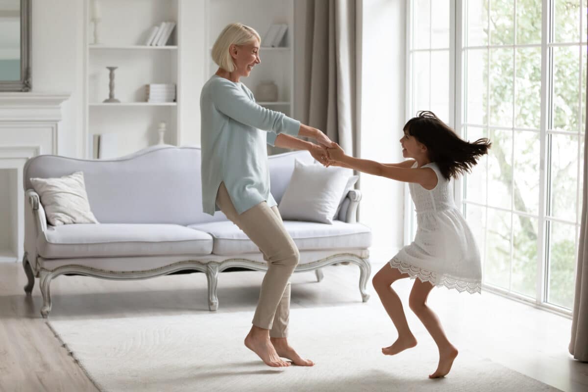 Grandmother dancing with granddaughter