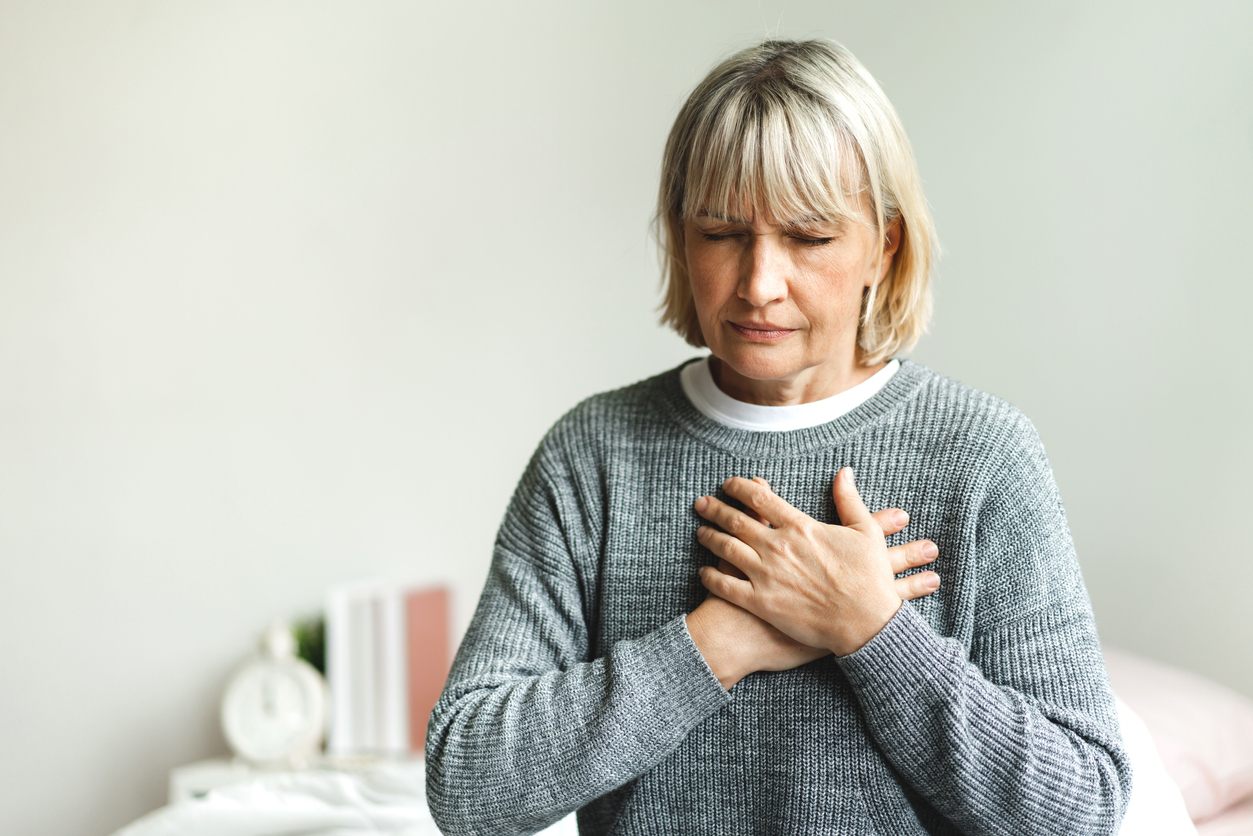 woman experiencing chest pain needs to have a heart test done. Stress test vs echocardiogram