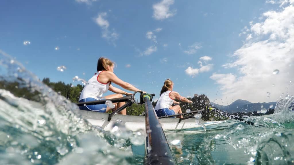 Two female rowers on a lake, workout, nature