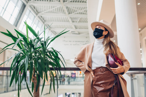 Fall wardrobe essentials to buy now - woman in mask at mall