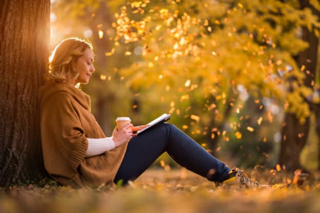 Fall reading or November reading list; Woman reading under a tree