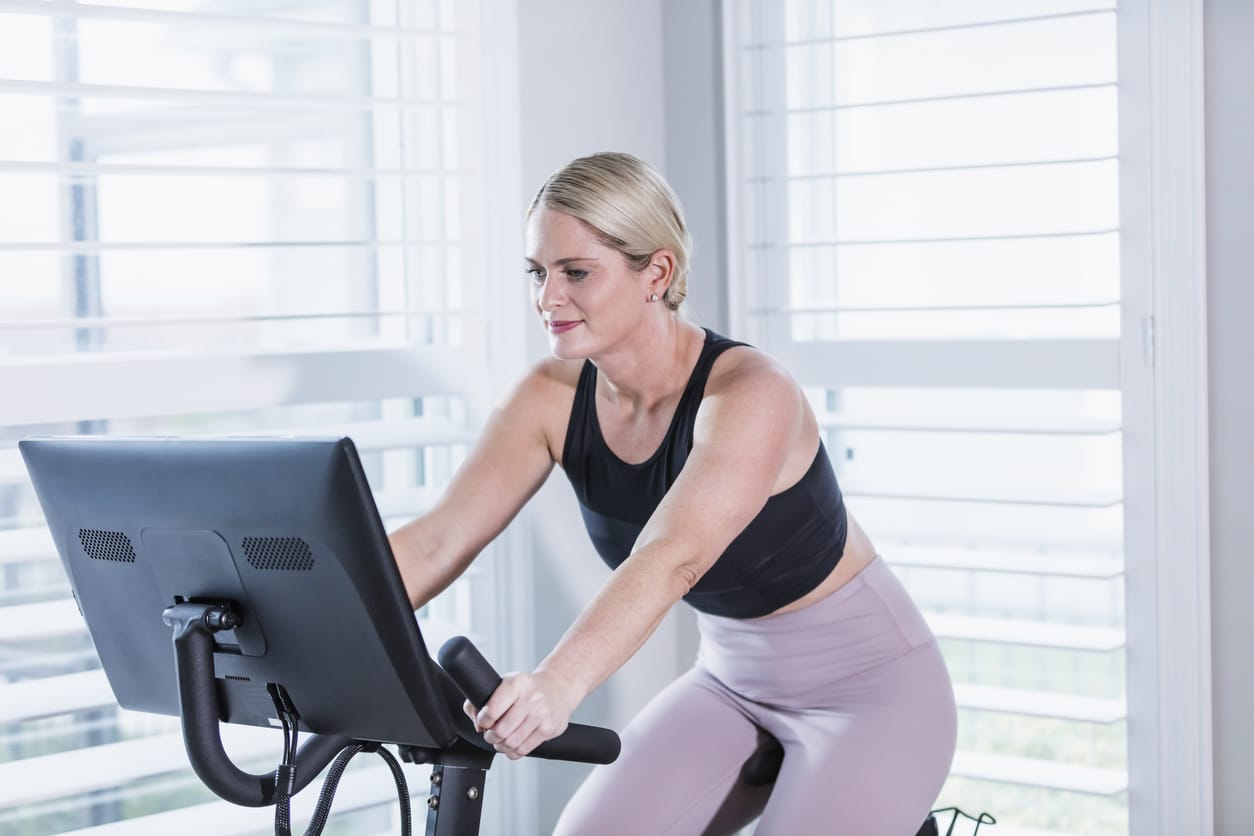 Woman on a MyX Fitness Bike, workout bike, at-home workouts