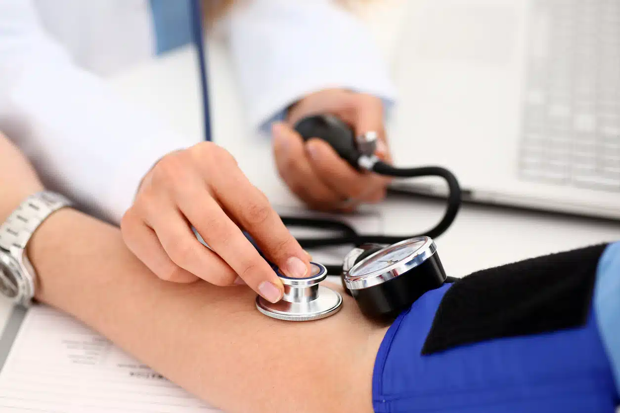 Metabolic health and woman checking blood pressure