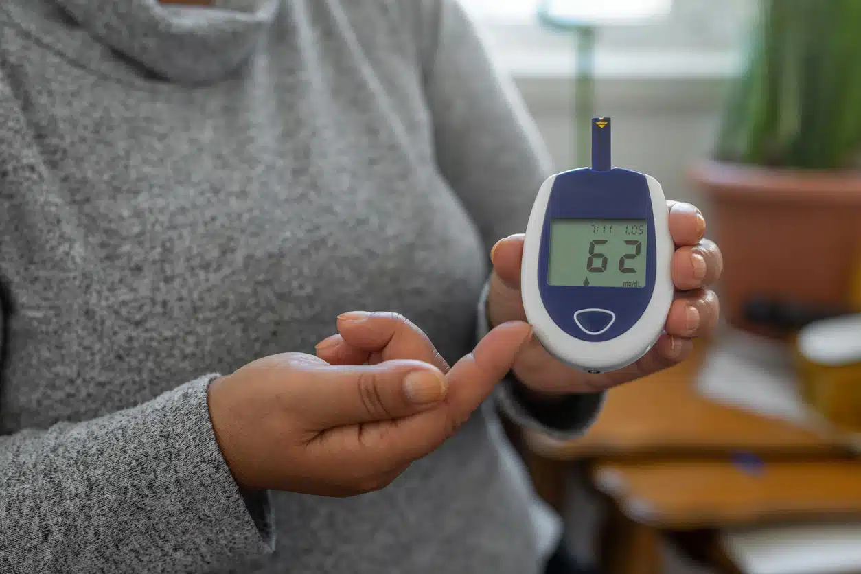 Metabolic health and woman checking blood sugar