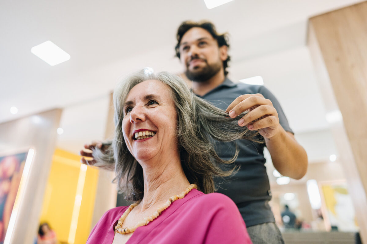 Woman with hairdresser, at salon