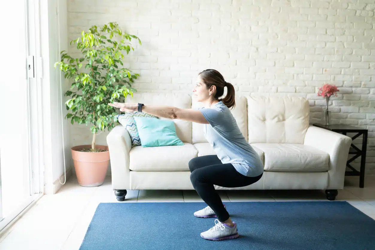 Woman doing squats to get rid of pancake butt and tighten her booty