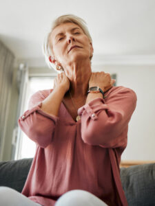 Woman with back or neck pain or osteoporosis