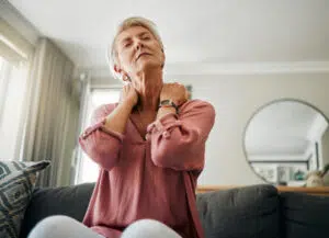 Woman with back or neck pain or osteoporosis