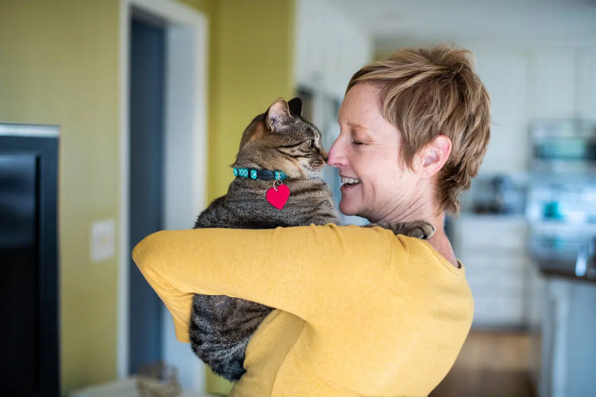woman holding a cat