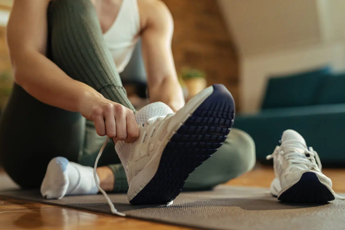 woman getting ready putting shoes on