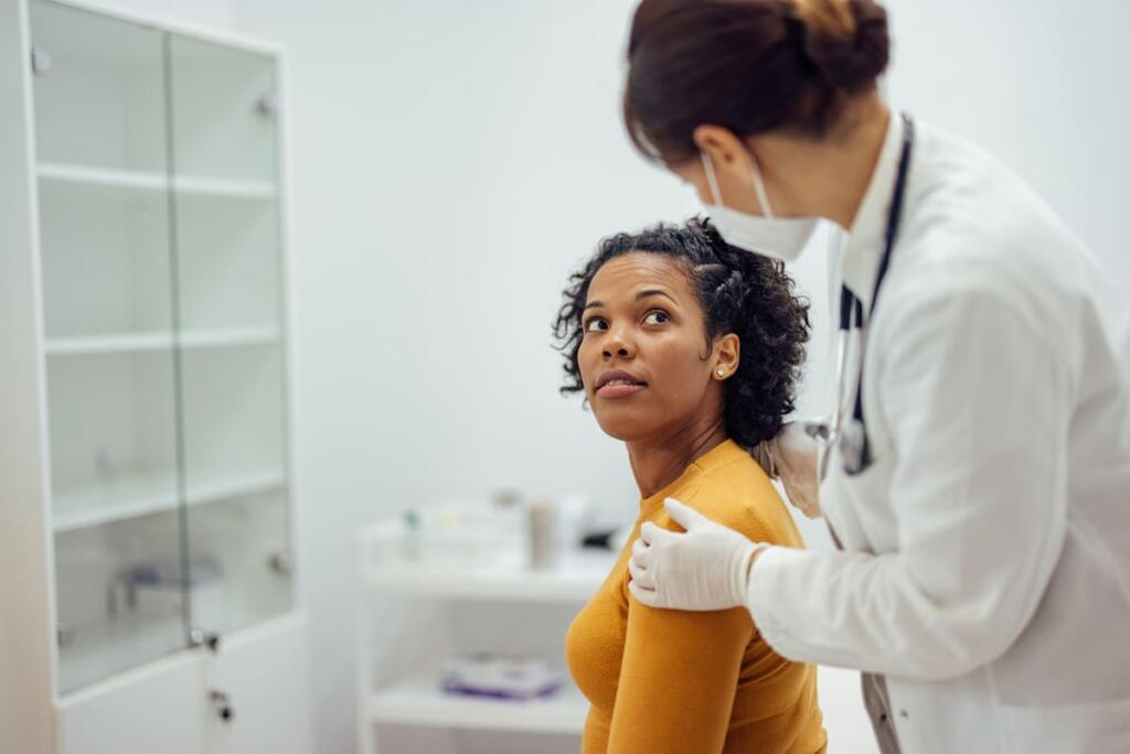 Discussing hair loss with doctor