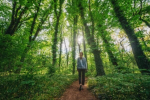 Woman walking alone when unplugging from society and technology