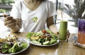 Woman eating a meal built around the keto diet