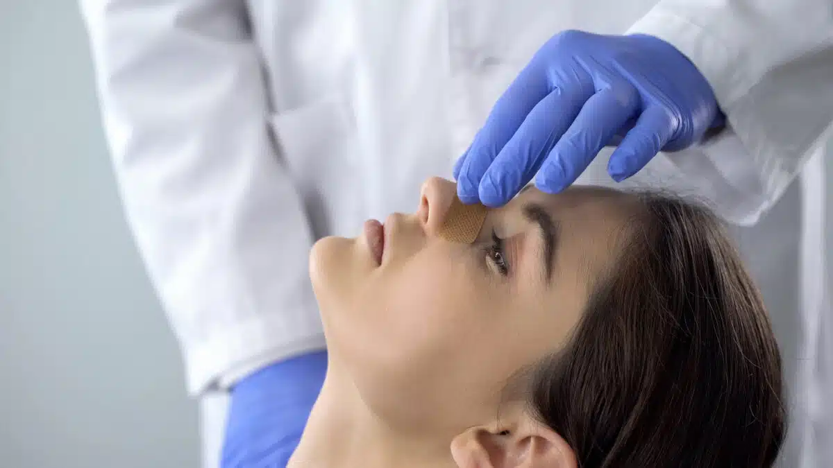 Bandage on nose; nose job; doctor exam