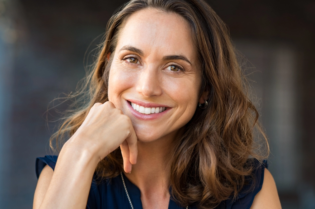 Smiling woman after doing broadband laser technology with BBL Hero