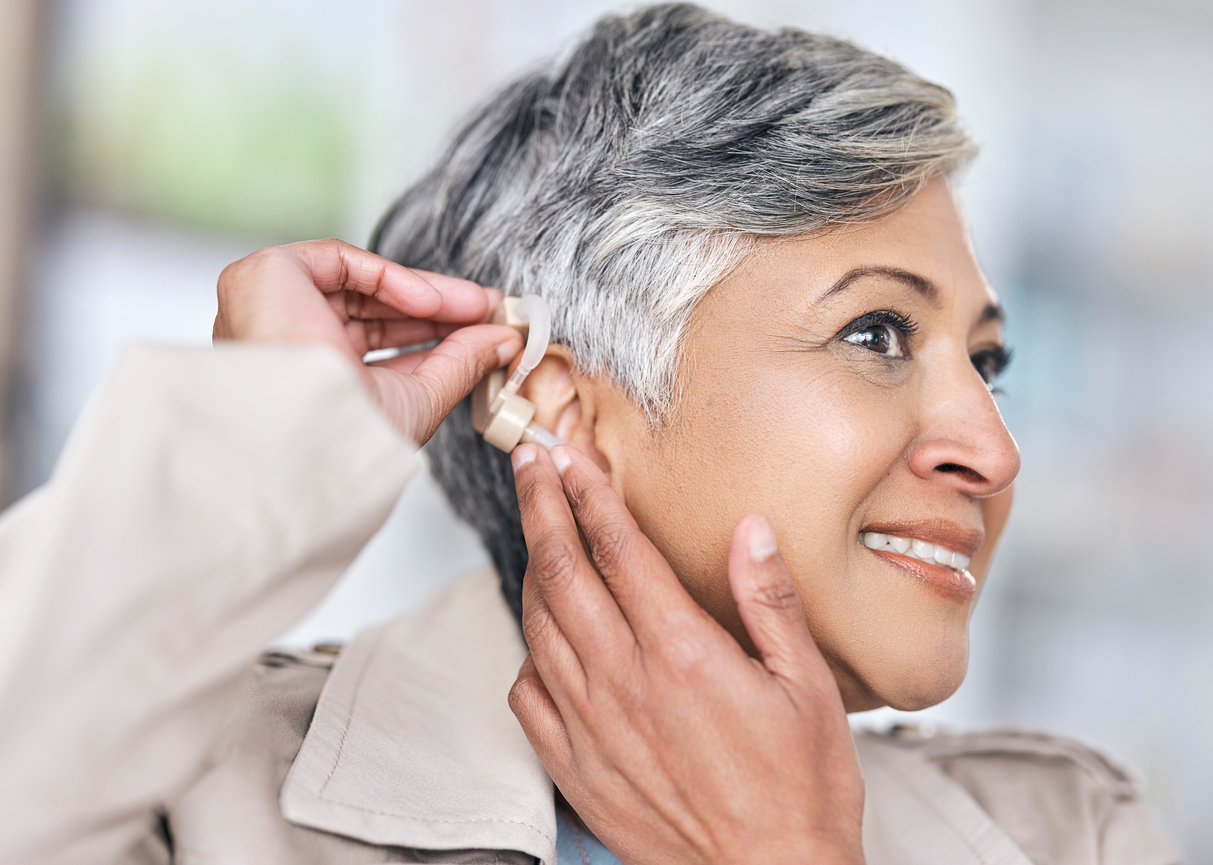 Coping with Hearing Loss -- Hearing aid, medical and deaf with senior woman with a disability for healthcare, technology and sound waves. Medicine, wellness and audio with person and cochlear implant for hearing loss treatment