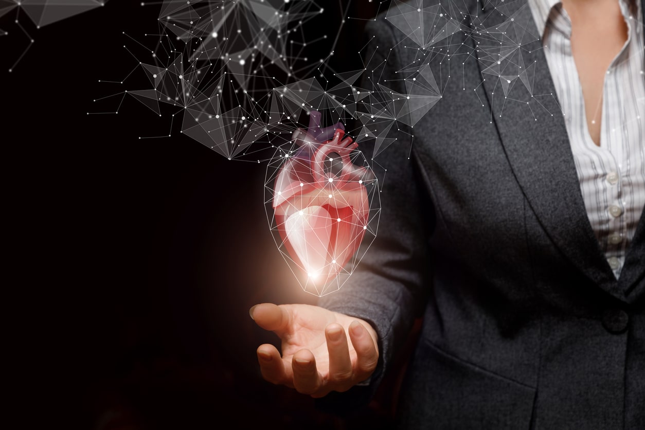 Woman holding image of a heart