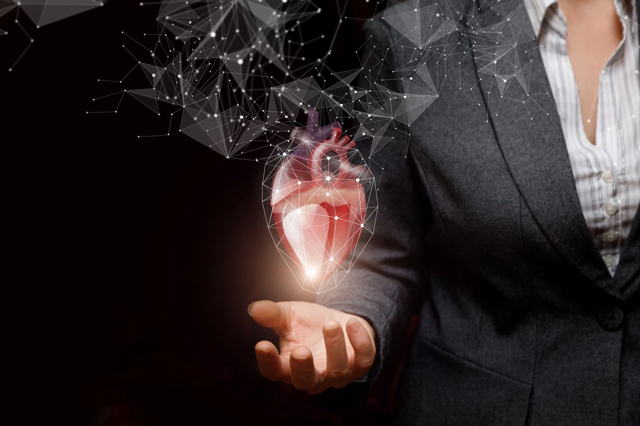 Woman holding image of a heart
