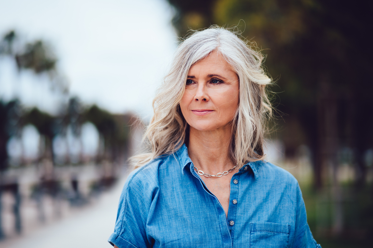 Beautiful woman with gray hair makeover