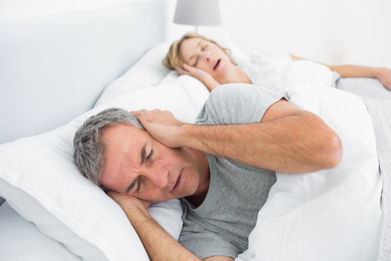 menopause and snoring, couple in bed