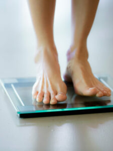 cropped-woman-on-scale.jpg