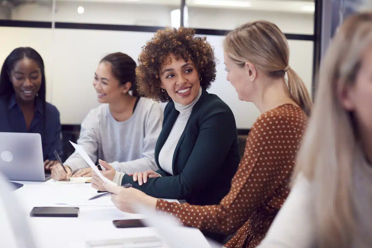 Women at the office around a conference table
