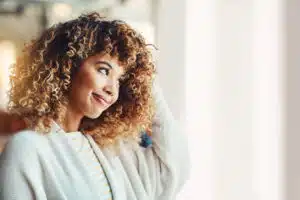 African American woman with blonde highlights on black hair