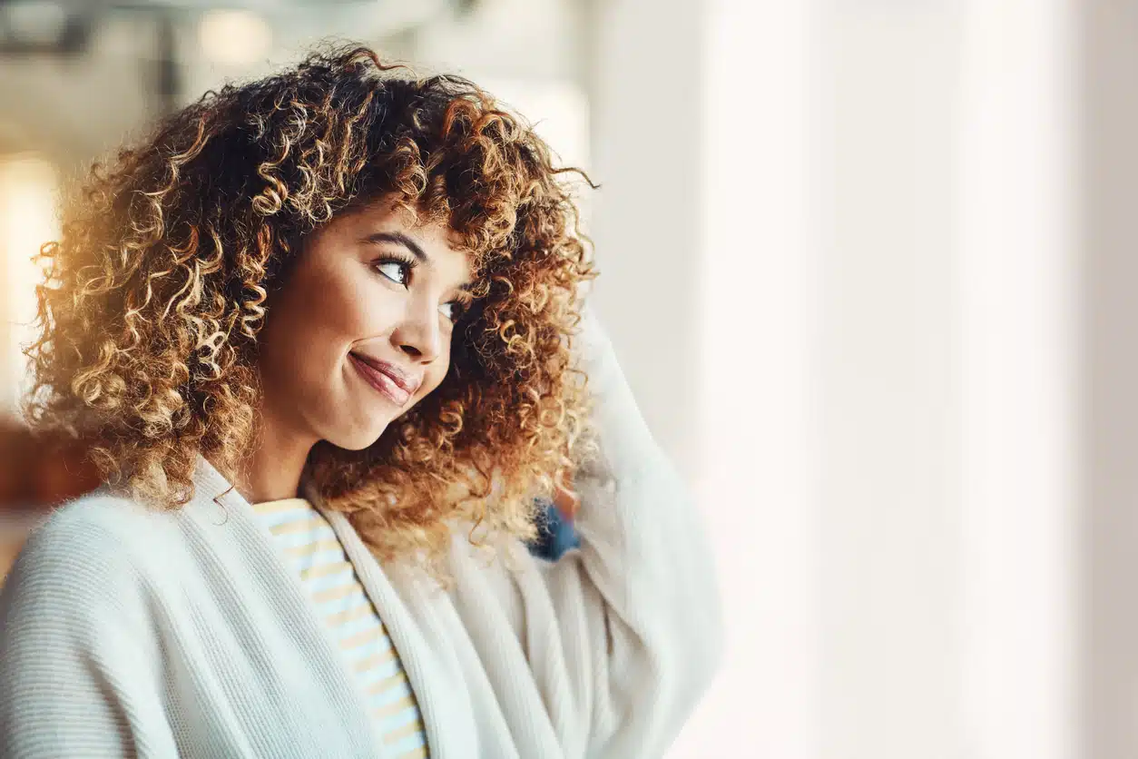 African American woman with blonde highlights on black hair