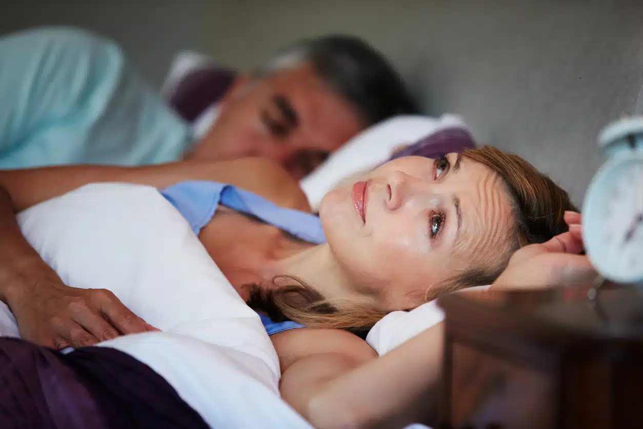 Couple in bed, wife can't sleep, low libido, too much on mind