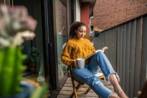 Woman reading a book for the October reading list