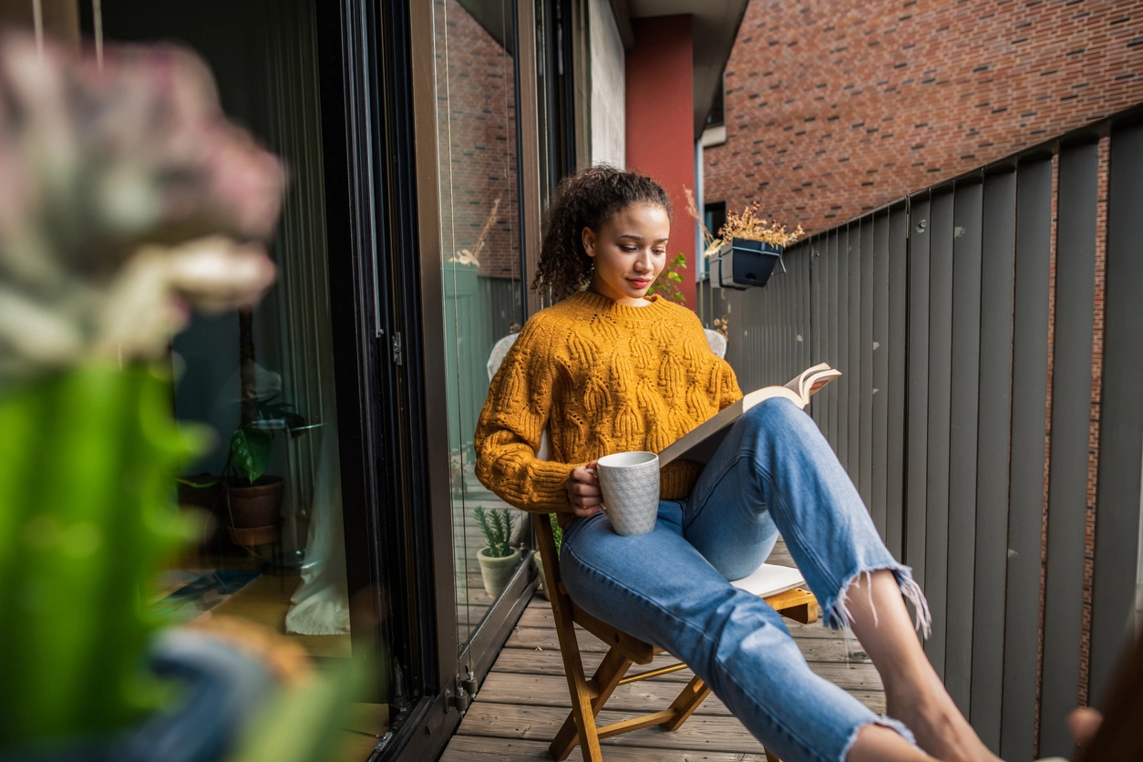 Woman reading a book for the October reading list