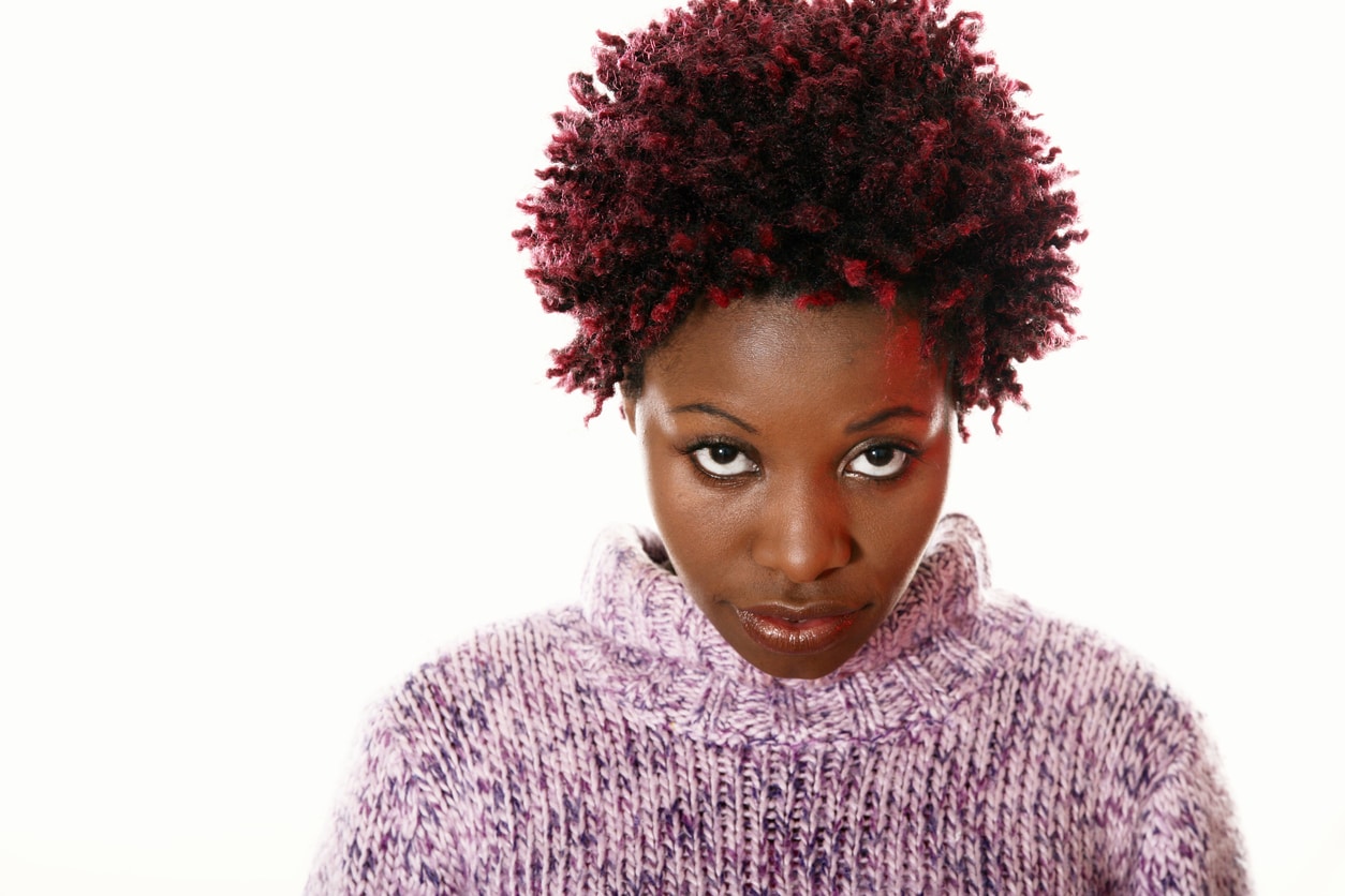Young African-American woman with red highlights in her black hair