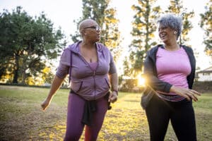 Two African American Women walking - Calibrate weight loss