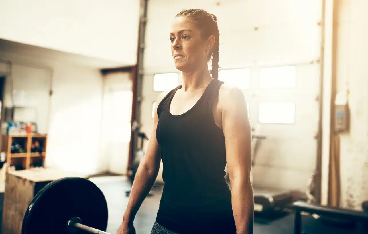 Female bodybuilder; woman working out; exercise; lift weights