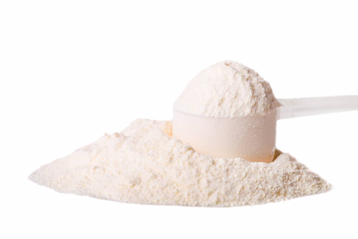 Scoop of protein powder pre-workout supplement