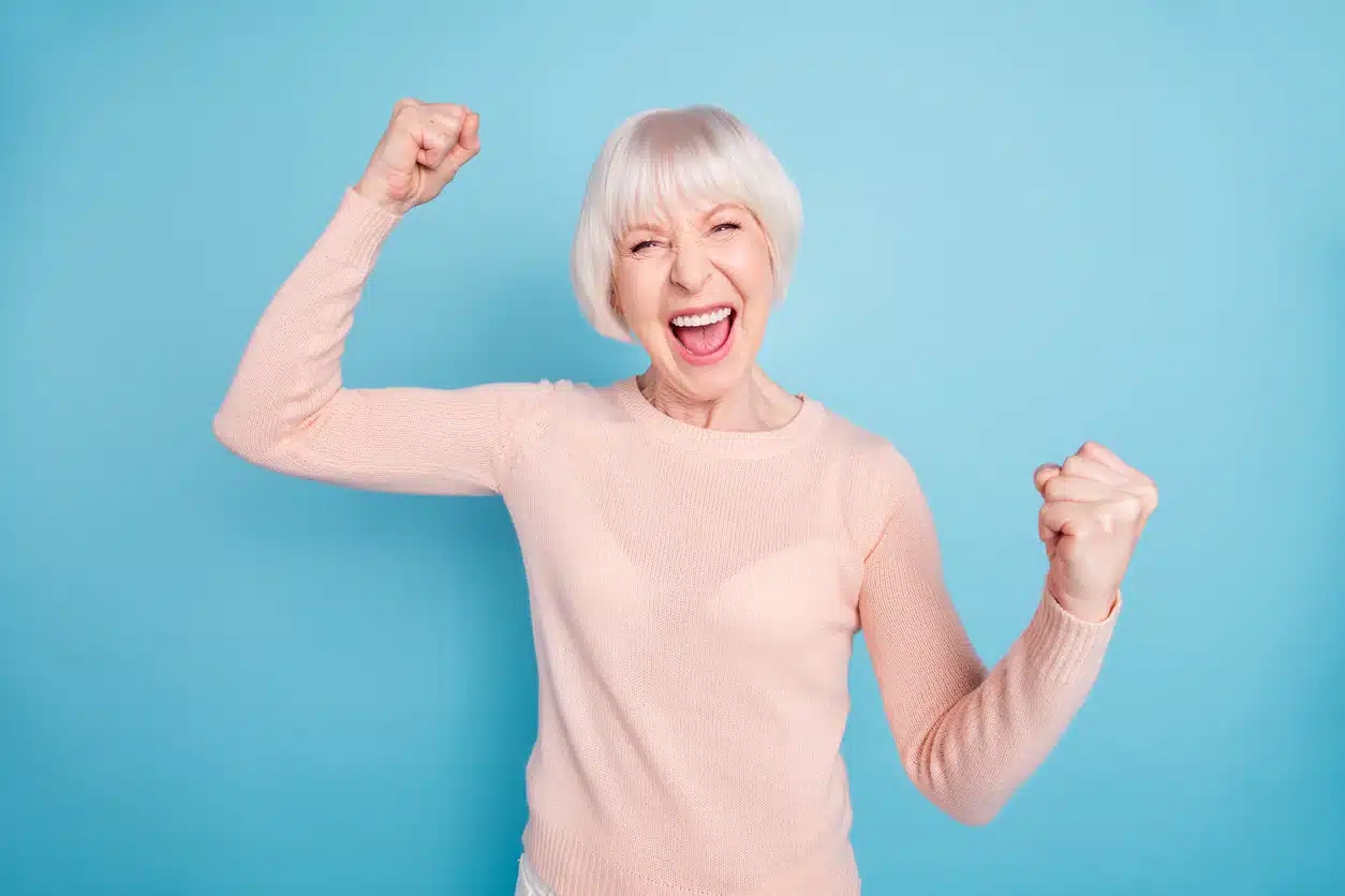 Woman with white hair celebrating
