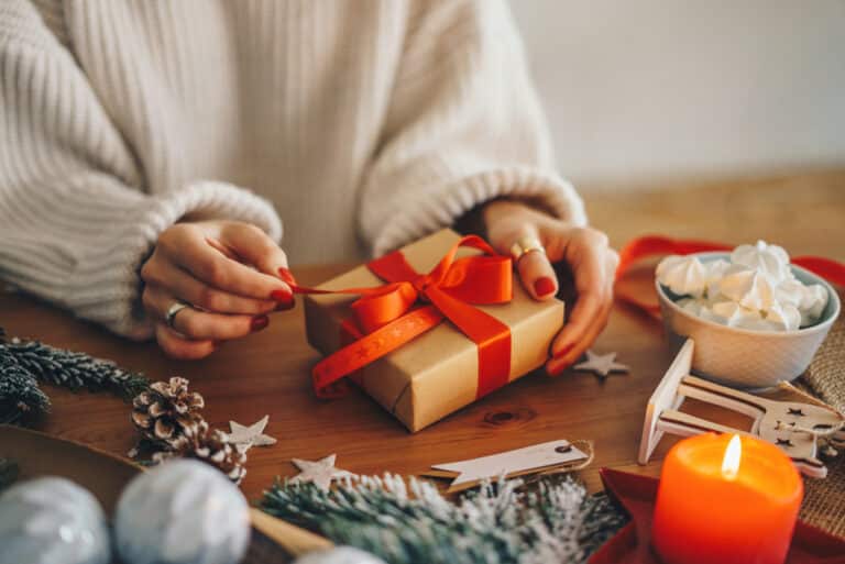 Gifts for her, gifts for women, woman opening a present