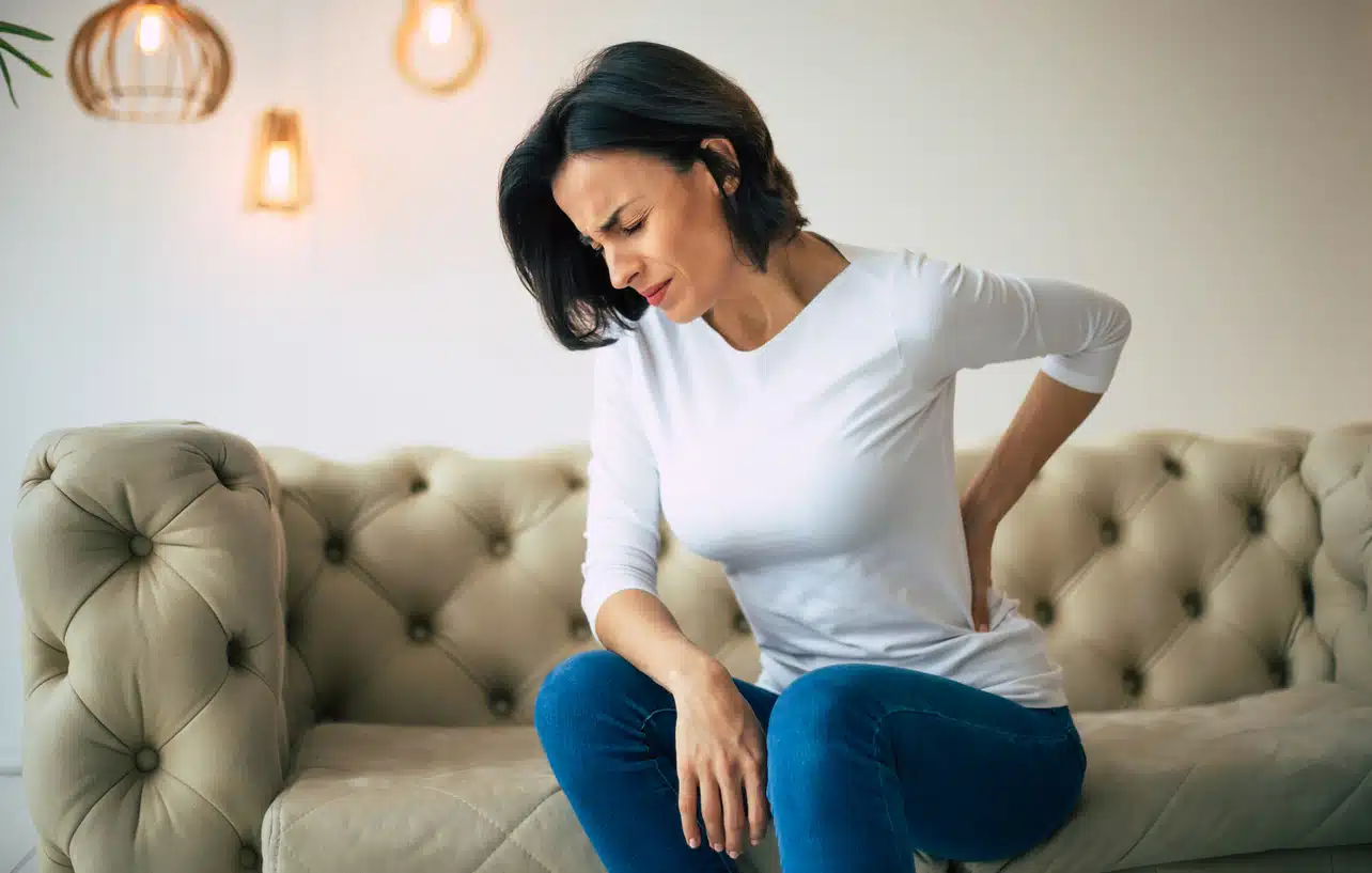 Woman with a sore back, pain relief
