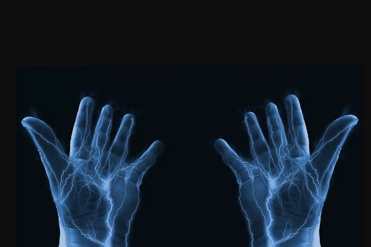 Hands with electricity running through them