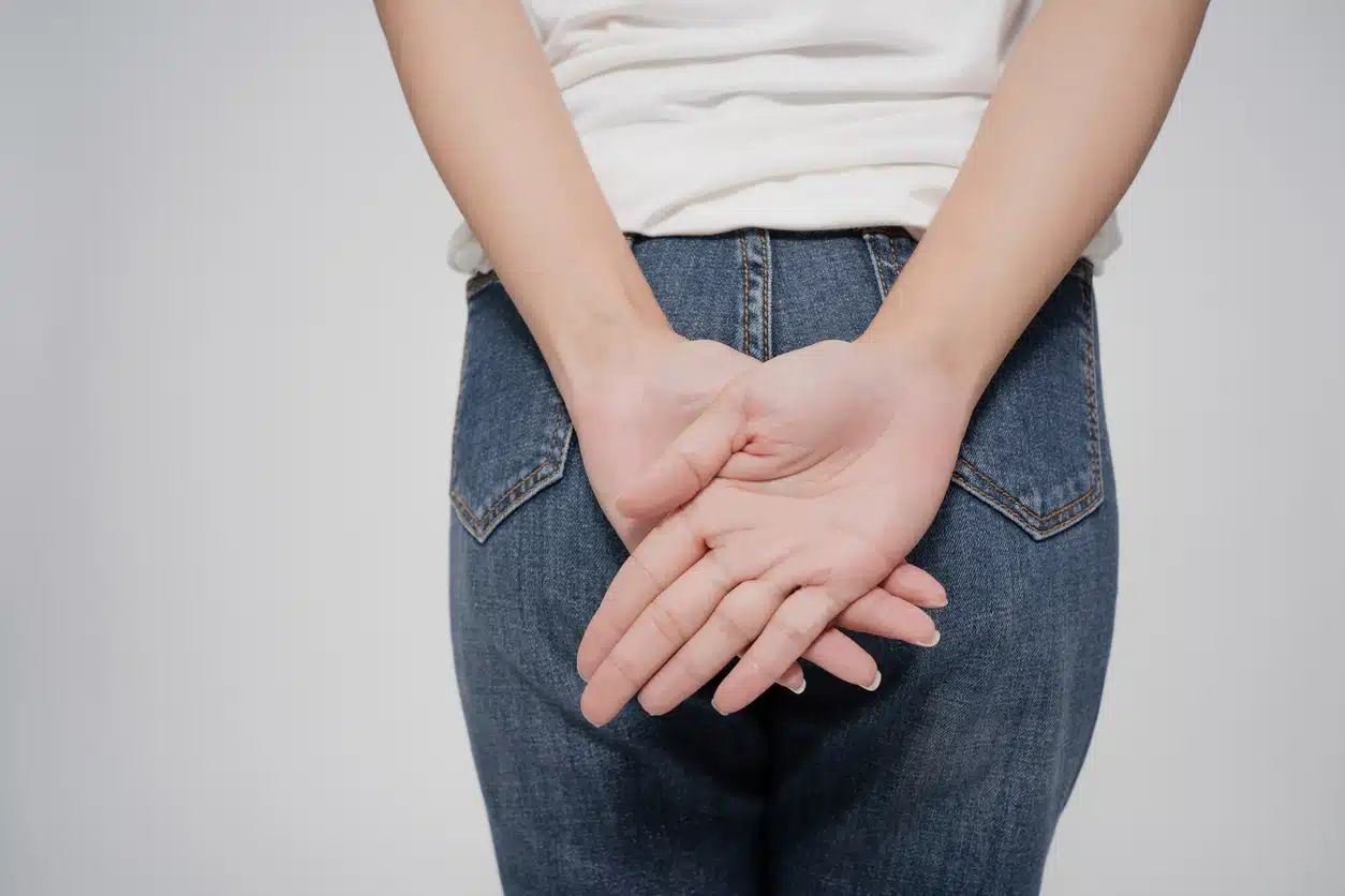 Essential Oils for Hemorrhoids, woman covering her rear end