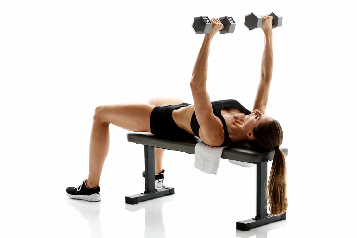 Woman doing a dumbbell chest press