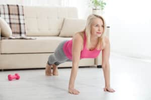 3 Ways to Lift Sagging Breast - Woman doing a pushup or a plank