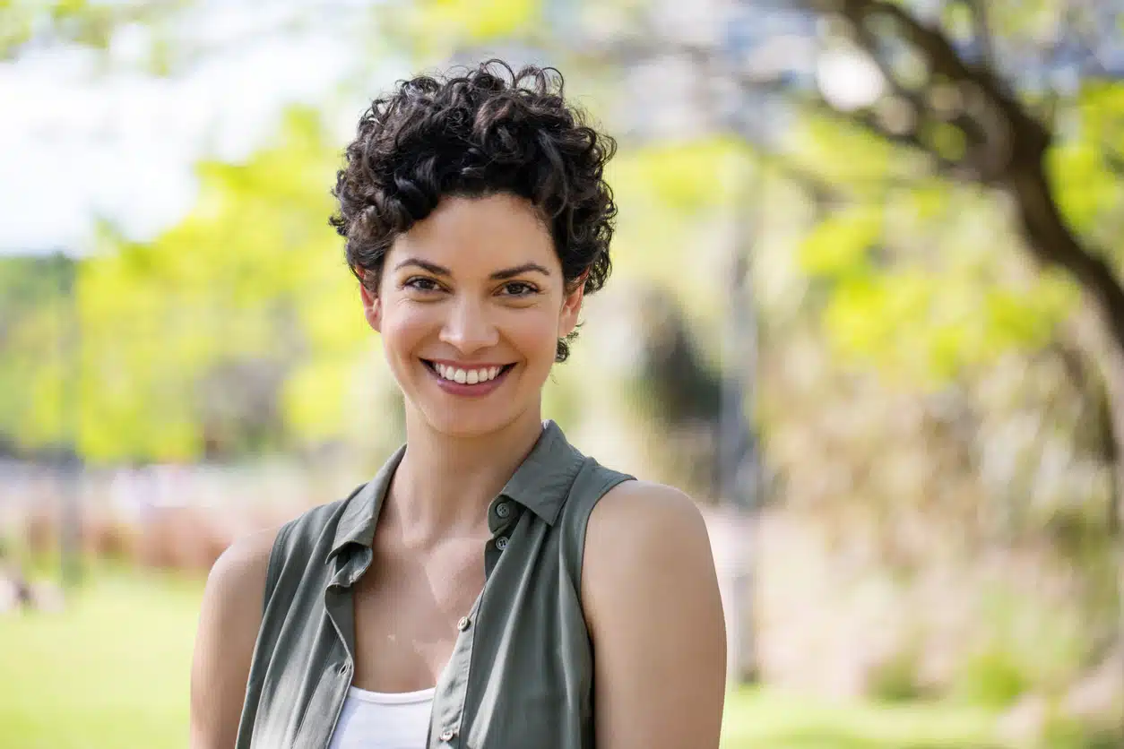 Woman with a short curly pixie haircut