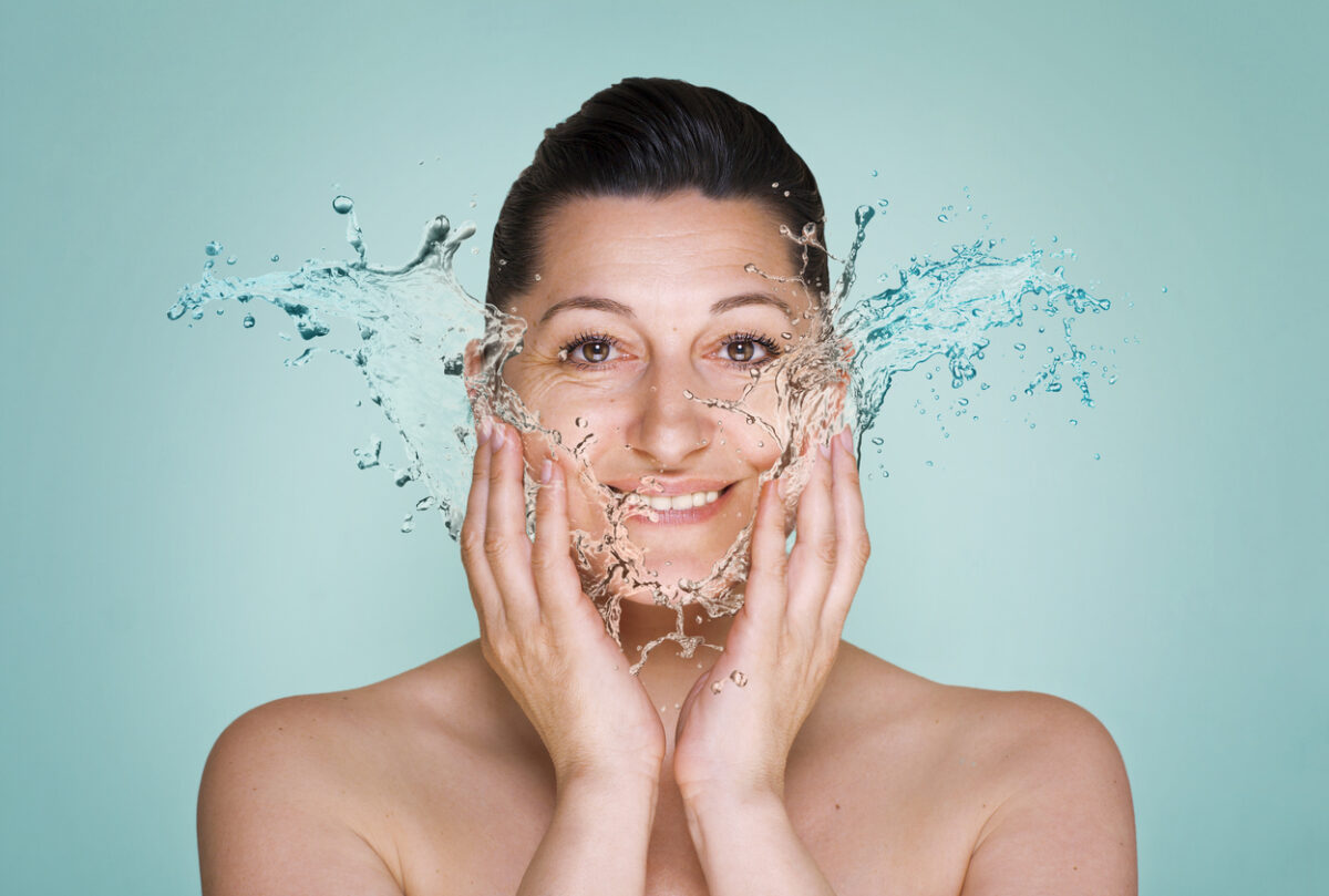 woman washing or rinsing her face