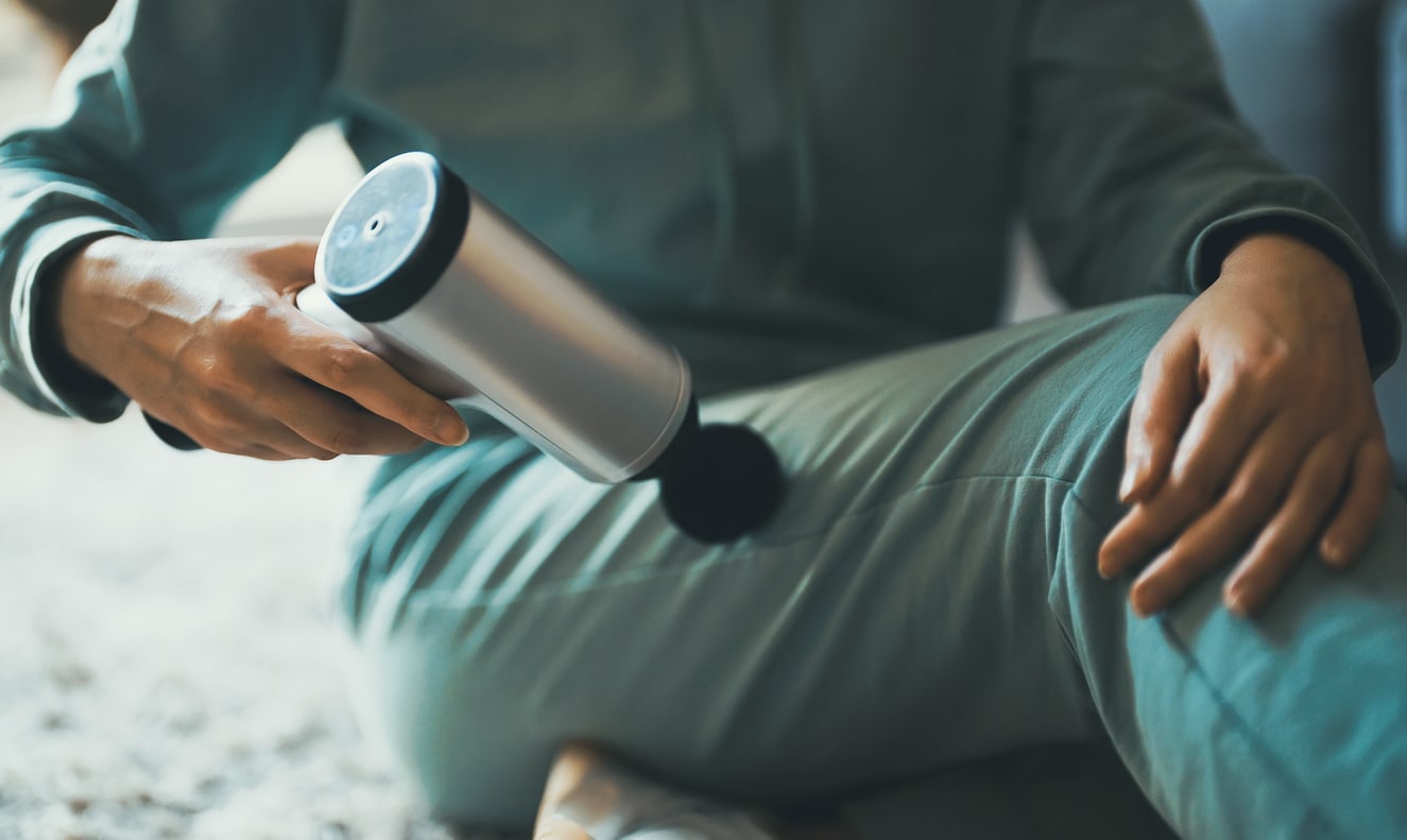 Exercises for sit bone using a massage gun